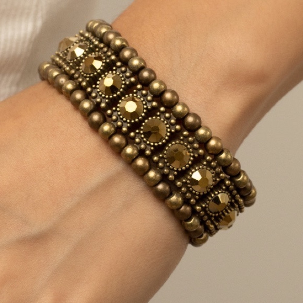 5 for 25 Brass tone stretch bracelet with brass colored stones.